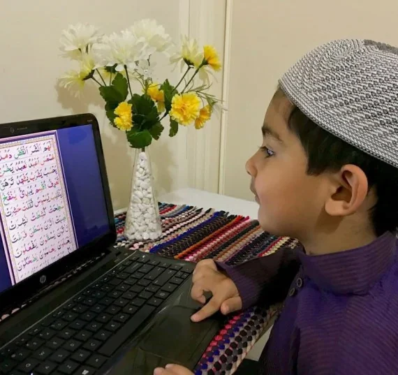 Child learning Quran online.